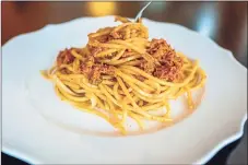  ?? Andrew Rush / TNS ?? Spaghetti served with piquant sun-dried tomatoes and pistachio pesto.