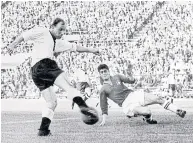  ?? AFP ?? German footballer Uwe Seeler, left, attempts a shot against Switzerlan­d at the 1962 World Cup.