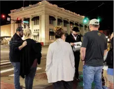  ?? Arkansas Democrat-Gazette/SEAN CLANCY ?? Paul Prater (center), points to a photo during a recent Haunted Argenta Ghost Tour in downtown North Little Rock.