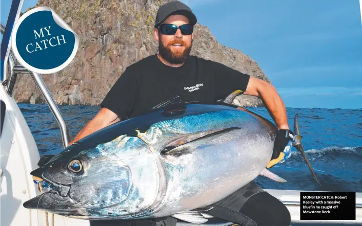  ??  ?? MONSTER CATCH: Robert Keeley with a massive bluefin he caught off Mewstone Rock.