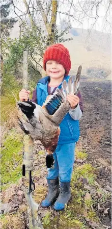  ??  ?? Jayden Wells, 5, tagged along on a duck-hunting excursion for the first time.