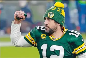  ?? MIKE ROEMER/AP PHOTO ?? Green Bay Packers quarterbac­k Aaron Rodgers pumps his fist after an NFL divisional playoff game against the Los Angeles Rams on Jan. 16 in Green Bay, Wis.