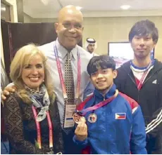  ??  ?? GAP president Cynthia Carrion (left) with World Artistic Gymnastics floor exercise bronze medalist Caloy Yulo, coach Munehiro Kugimiya and FIG technical committee head Steve Butcher in Doha.