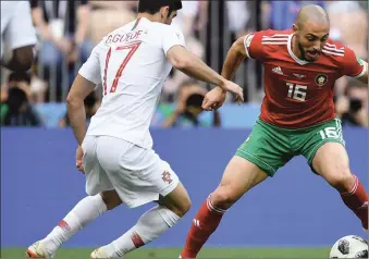  ??  ?? Noureddine Amrabat of Morocco takes on Goncalo Guedes of Portugal during the Group B match between Portugal and Morocco at Luzhniki Stadium, Moscow