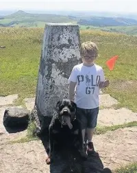  ??  ?? Stan with Kubrick at the summit of Shining Tor