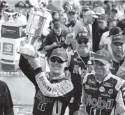 ?? MATT SULLIVAN Getty Images ?? Kevin Harvick celebrates in Victory Lane after winning NASCAR’s Big Machine Vodka 400 at the Brickyard.