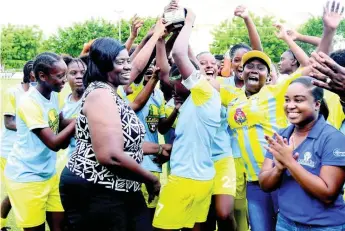  ?? FILE ?? Waterhouse Women FC celebrate with their JFF Women’s League Mid Season final trophy after defeating Arnett Gardens 2-1 in the final on Sunday, August 19, 2018.