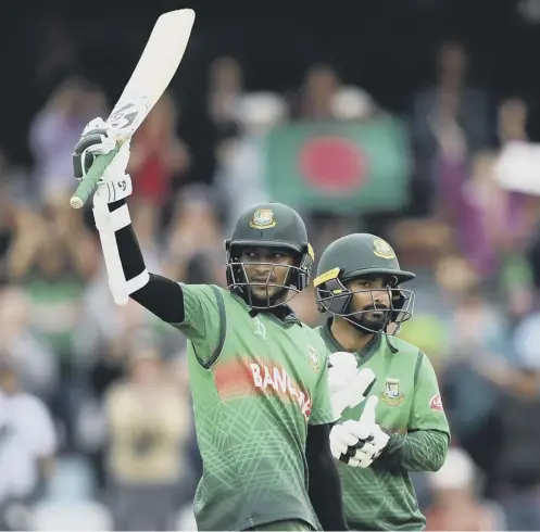  ??  ?? 0 Shakib Al Hasan celebrates his century with Bangladesh team-mate Liton Das during their win over West Indies at Taunton.