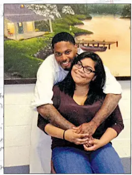  ?? Courtesy of Claudia Cerna ?? Wayne Young and Claudia Cerna hug during a visitation. The two met when Young was already in prison and plan to get married before the end of this year. “Destined” (background) is a poem by Young.