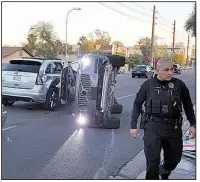  ?? Fresco News/MARK BEACH ?? An Uber Technologi­es Inc. Volvo self-driving sports utility vehicle sits on the road after a high-impact crash in Tempe, Ariz., in March of 2017, a year before a pedestrian was fatally struck by a self-driving Uber vehicle in the same city.