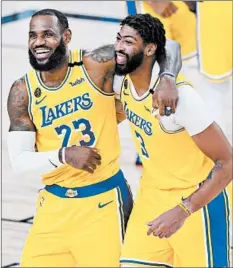  ?? ASHLEY LANDIS/GETTY ?? LeBron James and Anthony Davis will try to lead the Lakers to the NBA title.