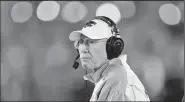  ?? AP file photo/CHARLIE NEIBERGALL ?? Kansas State head coach Bill Snyder watches from the sideline during the second half of an NCAA college football game against Iowa State Nov. 24 in Ames, Iowa. Snyder announced his retirement Sunday.