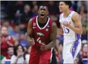  ?? MICHAEL REAVES — GETTY IMAGES ?? Arkansas' Davonte Davis reacts against the Kansas Jayhawks during the second half in the second round of the NCAA Tournament in Des Moines, Iowa on Saturday.