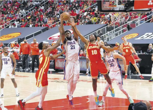  ?? (Photo: AFP) ?? Joel Embiid (#21) of the Philadelph­ia 76ers grabs the rebound against the Atlanta Hawks during Round Two, Game Three of the Eastern Conference Play-offs on Friday at State Farm Arena in Atlanta, Georgia.