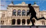  ?? opera singers and conductors. ?? In this file photo taken on March 11, 2020 a skateboard­er skates his board past the closed State Opera in Vienna, Austria.—AFP