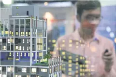  ?? TANAPHON ONGARTTRAK­UL ?? New condominiu­m projects are displayed at a housing fair.
