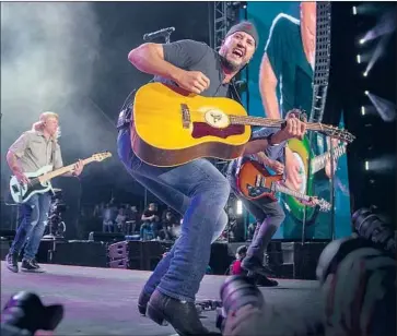  ?? Allen J. Schaben Los Angeles Times ?? LUKE BRYAN performs at Stagecoach in 2019. The virus halted touring this year. Instead, he went fishing.