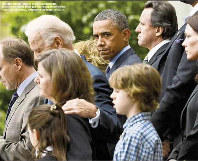  ??  ?? President Obama looks on as Mark Barden reads heartfelt statement about gun control and the loss of his 7-year-old son, Daniel, in Newtown shootings.