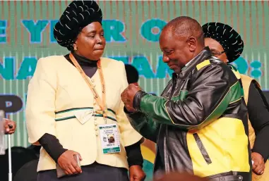  ?? PICTURE: SIMPHIWE MBOKAZI ?? READY TO DO BATTLE: Nkosazana Dlamini Zuma and Deputy President Cyril Ramaphosa show a friendly face at the ANC’s national policy conference at Nasrec in Joburg earlier this year. The pair are poised for a bruising showdown in the leadership battle at...