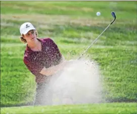  ?? PETE BANNAN — DIGITAL FIRST MEDIA ?? West Chester Henderson’s Pat Muth hits out of the sand on the third hole during Thursday’s match against Bishop Shanahan at West Chester Golf & Country Club.