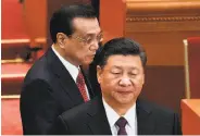  ?? Nicolas Asfouri / AFP / Getty Images ?? Chinese President Xi Jinping (right) and Premier Li Keqiang arrive for the parliament session.