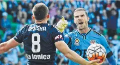  ??  ?? CAUGHT OFF-GUARD: Glory goalkeeper Ante Covic not happy with Besart Berisha after the Victory striker received a penalty.