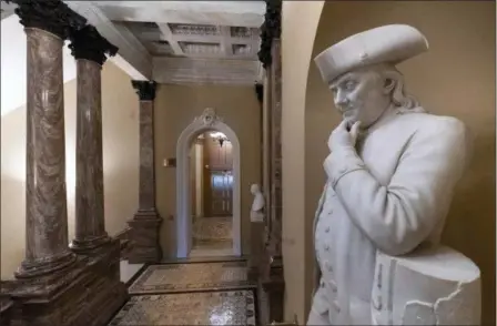  ?? J. SCOTT APPLEWHITE — THE ASSOCIATED PRESS ?? A statue of Benjamin Franklin is seen in an empty corridor outside the Senate at the Capitol in Washington, Thursday during a partial government shutdown. Chances look slim for ending the partial government shutdown any time soon.