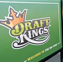  ?? CHRISTOPHE­R EVANS / BOSTON HERALD ?? ‘LOOKING FORWARD’: A 2015 campaign for DraftKings is seen at Boston’s North Station, above and far right. The company wants to expand its offerings in Massachuse­tts by convincing the state to allow legal betting on sporting events. Race &amp; Sports SuperBook, below, at the Westgate Las Vegas Resort &amp; Casino, features a dizzying array of bets available.