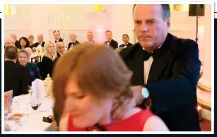  ??  ?? NECK HOLD: Tory MP Mark Field removes a protester from a black-tie dinner on Thursday night