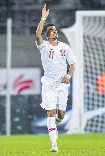  ??  ?? Qatar’s Akram Afif celebrates after scoring against Switzerlan­d.