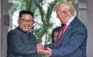  ?? PHOTO: REUTERS ?? US President Donald Trump meets North Korean leader Kim Jongun at the Capella Hotel on Sentosa Island in Singapore.