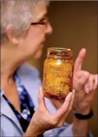  ?? Democrat-Gazette file photo/ANDY SHUPE ?? Instructor Susan Pickle talks pickles during a training session for county fair judges conducted in 2013 by the University of Arkansas Cooperativ­e Extension Service in Fayettevil­le.