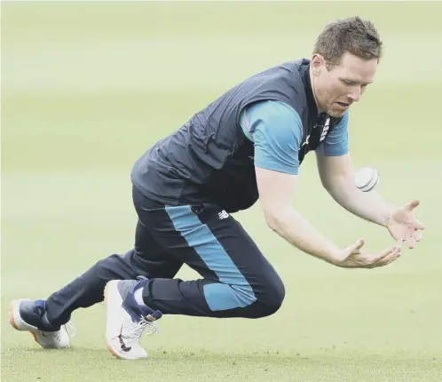  ??  ?? 0 England captain Eoin Morgan attempts a catch during a nets session ahead of today’s T20 series opener against Sri Lanka in Cardiff.