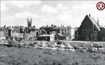  ??  ?? 1972 - A splendid view taken from Apsley Street illustrati­ng the town beyond Bank Street in the background with the former Methodist Church (centre) and Hempsted Street (foreground) being used as a temporary car park, on land where houses once stood. The church of St Mary the Virgin can be seen in the background