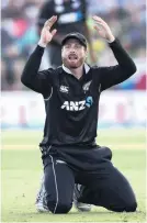  ??  ?? So close . . . Martin Guptill reacts in the field during Sri Lanka’s chase.