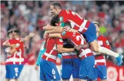  ?? AP ?? Granada players celebrate at the end of the match.