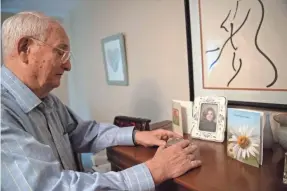  ?? JASPER COLT/USA TODAY ?? Ron Byrd closes a memento box on his dresser. He says his daughter Erika, who died in 2011 at the age of 42, had unfulfille­d dreams of having a child. “She wanted so desperatel­y to have a baby,” he says.