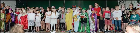  ??  ?? Sacred Heart Primary School students sang and danced the night away.