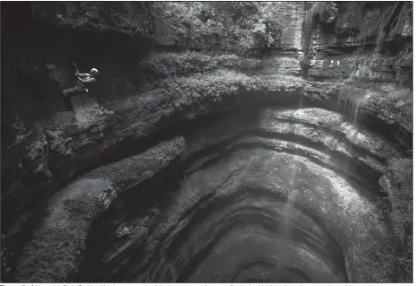  ?? (Special to the Democrat-Gazette/Ryan Mauer) ?? The mouth of Neversink Pit in Fackler, Ala., is an example of the beauty caves have to offer. It also highlights how dangerous the activity can be.