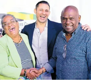  ?? GLADSTONE TAYLOR/MULTIMEDIA PHOTO EDITOR ?? From left: Sharon Hay Webster of the Jamaica Labour Party; Brian Schmidt, vice president of the Jamaica Debates Commission; and Collin Campbell of the People’s National Party share a laugh during the launch of the 2024 local government election debates on Friday. The two debates, featuring teams from the two main political parties, will take place next week.
