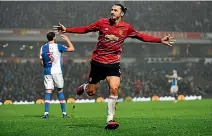  ??  ?? Zlatan Ibrahimovi­c celebrates his winning goal for Manchester United against Blackburn Rovers to set up a FA Cup quarterfin­al date with Chelsea.