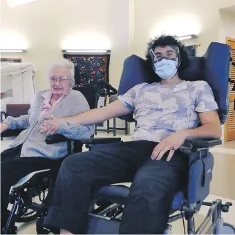  ?? SAANICH PENINSULA HOSPITAL & HEALTHCARE FOUNDATION ?? Saanich Peninsula Hospital patient Ruth Elliot and Lucas Gentina sit together in wheelchair­s.