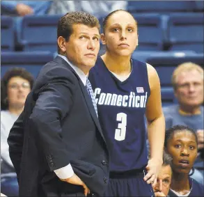  ?? Bob Child / Associated Press ?? UConn coach Geno Auriemma and Diana Taurasi watch the action from the sidelines in the closing minutes of an exhibition in 2003.