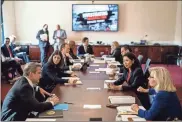  ?? Kent nishimura/los angeles times/tns ?? Members of the House select committee investigat­ing the deadly pro-Trump invasion of the U.S. Capitol meet in a room ahead of the first hearing in the Cannon House Office Building on Capitol Hill in Washington, D.C., on July 27.