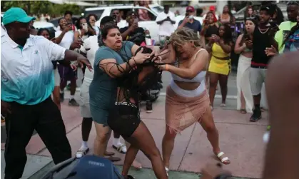  ?? ?? Women fight on the street near Ocean Drive in Miami Beach, Florida, on 19 March 2021. Photograph: Joe Raedle/Getty Images