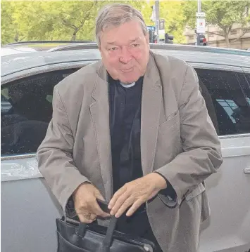  ?? Picture: AAP/LUIS ASCUI ?? CHARGES: Cardinal George Pell arrives at court in Melbourne yesterday.