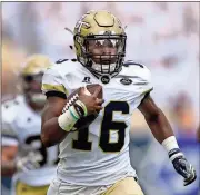  ?? Jon Barash / The Associated Press ?? Georgia Tech quarterbac­k TaQuon Marshall (16) runs for a touchdown during the first half against Pittsburgh in Atlanta.