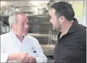  ??  ?? David Chang’s first episode of “Ugly Delicious” sets out to uncover how various chefs, including Wolfgang Puck, left, define pizza and its ever-evolving toppings.