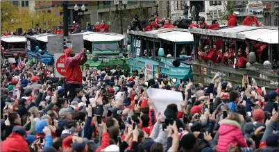  ?? AP PHOTO / ELISE AMENDOLA ?? Fans cheer the Boston Red Sox passing by in duckboats during a parade to celebrate the team's World Series championsh­ip over the Los Angeles Dodgers, Wednesday in Boston.