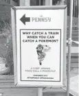  ??  ?? A sign at The Pennsy food court near New York’s Penn Station, urging passers-by to catch a Pokemon instead of a train. From doughnut shops to zoos, businesses and organizati­ons are finding creative ways to capitalize on “Pokemon Go.”